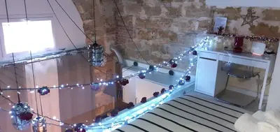 a room with christmas lights and a staircase at La Vecchia Stalla in Palermo