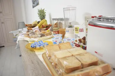 a table with bread and other food on it at B&B d'Orleans in Palermo