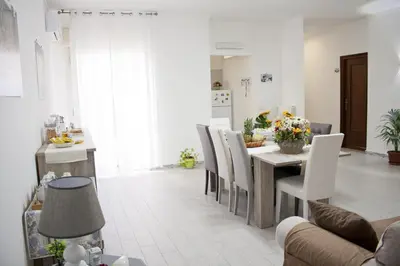 a kitchen and dining room with a table and chairs at B&B d'Orleans in Palermo