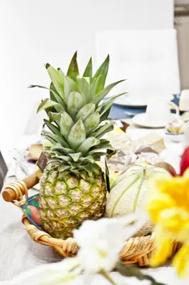 a pineapple sitting in a basket on a table at B&B d'Orleans in Palermo