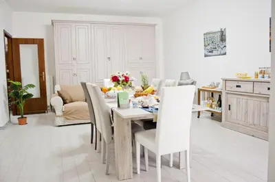 a kitchen and dining room with a table and chairs at B&B d'Orleans in Palermo