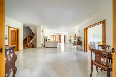 a large living room with a staircase and a living room at Il Giardino di Venere in Mondello