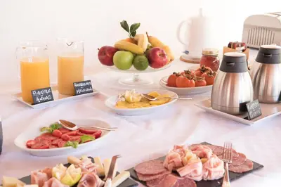 a table topped with plates of food and drinks at Il Giardino di Venere in Mondello