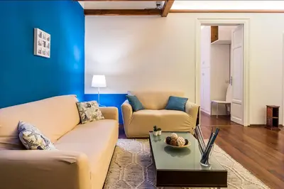 a living room with two couches and a table at Casa Valire in Palermo