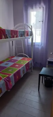 a bedroom with a bunk bed and a window at Appartamento 