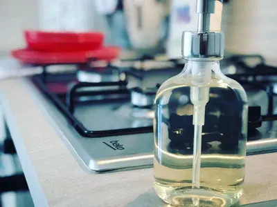 a bottle of oil sitting on top of a stove at Il Sole di Mondello in Mondello