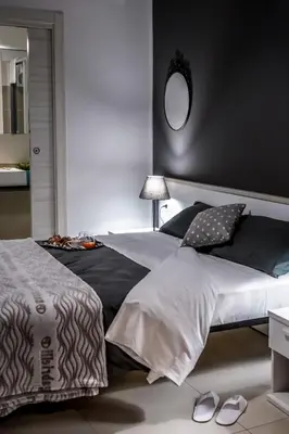a bedroom with a large bed with a mirror on the wall at Amarillo in Palermo