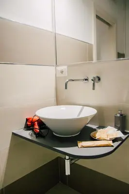 a white sink on a counter in a bathroom at Amarillo in Palermo