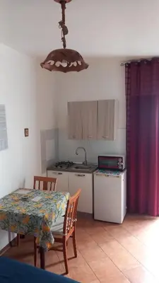 a kitchen with a table and a table and a table and a table at A casa SCALILLA in Palermo