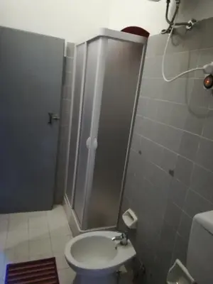a bathroom with a shower with a toilet and a sink at Casa in palazzo Graffeo Sven in Palermo