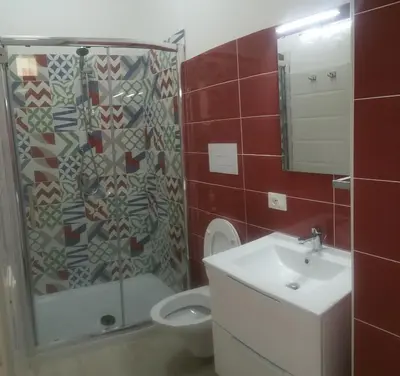a bathroom with a shower and a toilet and a sink at CASA VACANZE DEL GOLFO 2 in Castellammare del Golfo