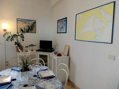 a room with a table and a map on the wall at Villa Flore in Casteldaccia