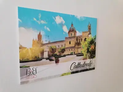 a painting of a building on a wall at B&B AL PASSIO in Palermo