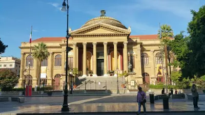 a large building with a dome on top of it at Benvenuti al Massimo in Palermo