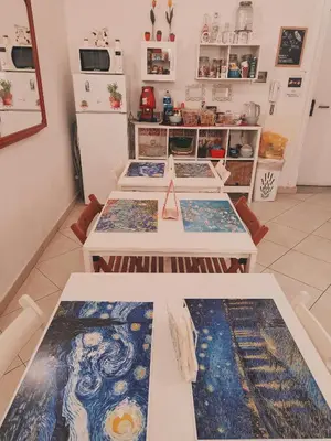 a bed with a blue comforter in a bedroom at B&B IL POETA in Palermo