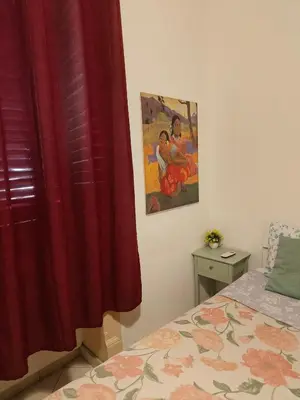a kitchen counter with a microwave and a refrigerator at B&B IL POETA in Palermo