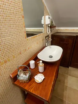 a bathroom with a sink and a mirror at MARE AZZURRO in Campofelice di Roccella
