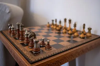 a chess set on a chess board on a table at Scirocco House in Palermo