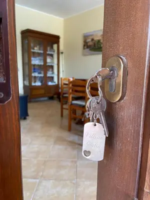 a door latch with a key in a room at Villino Giulia in Altavilla Milicia