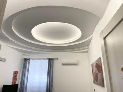 a white ceiling with a light fixture on it at B&B Antichi Cortili in Termini Imerese