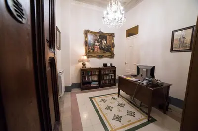 a living room with a couch and a flat screen tv at Medusa in Palermo