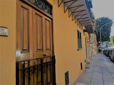 a building with a door on the side of a street at Hello Cathedral House in Palermo