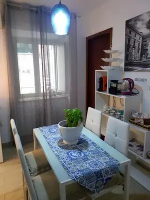 a dining room table with a bowl on top of it at Hello Cathedral House in Palermo