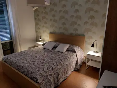 a bedroom with a bed with two pillows on it at Apartament Home Lory in Palermo