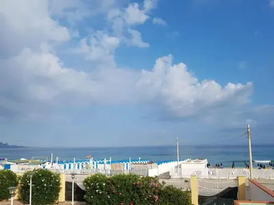 a view of the ocean from a building at Casavacanze corallo in Isola delle Femmine