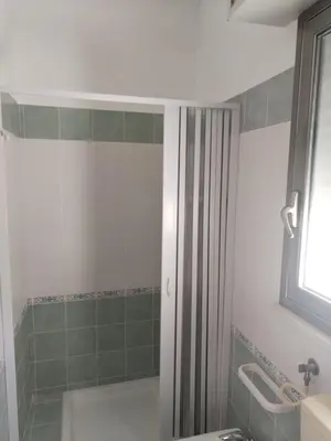 a bathroom with a shower and a sink at Casavacanze corallo in Isola delle Femmine