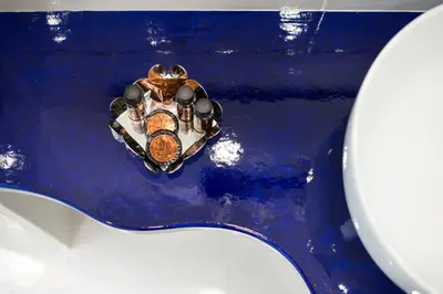a frog wearing a crown sitting on top of a toilet at COCCIU D’AMURI in Castellammare del Golfo
