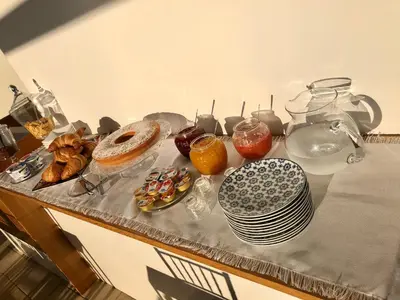 a table topped with plates and bowls of food at COCCIU D’AMURI in Castellammare del Golfo