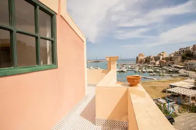a balcony with a view of a marina at Liberty house in Castellammare del Golfo