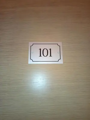 a sign that says on a wooden door at Amaryllis Hotel in San Vito lo Capo