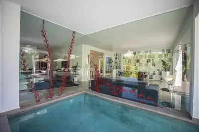 a house with a swimming pool in a room at Villa Corallo in Cinisi