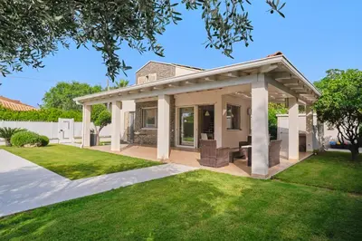 a home with a pavilion in a yard at Villa Sicilia in Lascari