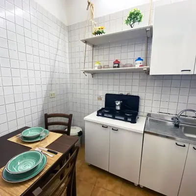 a kitchen with a table with plates on it at Marilù in Palermo