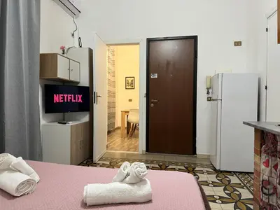 a room with a kitchen with towels on a table at Marilù in Palermo