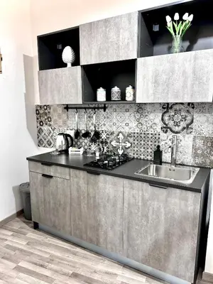 a kitchen with a sink and a counter top at Marilù in Palermo