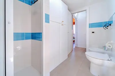 a bathroom with a shower and a toilet at Villa Ficodindia in Altavilla Milicia
