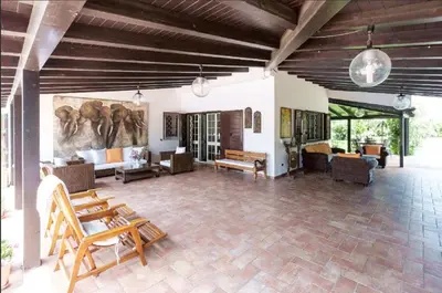 a large living room with couches and tables at RUMAH SAYA in Campofelice di Roccella