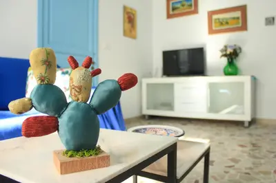 a cactus statue on a table in a living room at Narciso Blu in Castellammare del Golfo