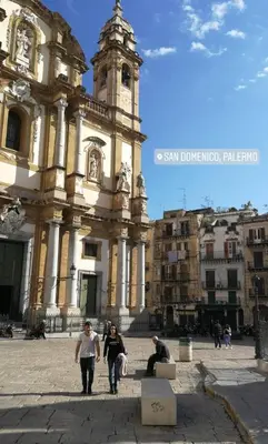 a group of people walking in front of a building at Amunì in Palermo