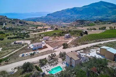 an aerial view of a villa with a vineyard and a house at Villa Montemar in Balata di Baida