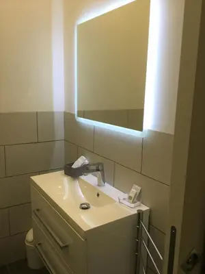 a bathroom with a sink and a mirror at Le vie del Centro in Palermo