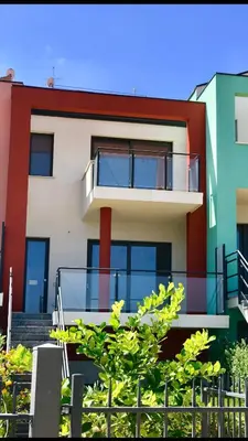 a building with a balcony in front of it at Red Luxury in Borgo Guardiola near Cefalù in Mandra Capreria