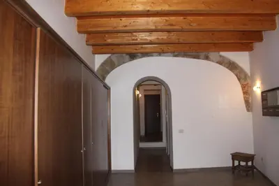 a hallway with a wooden ceiling and an archway at Cocciu d'amuri Central Apartment Spacious and Comfortable in Palermo