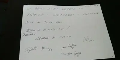 a piece of white paper with handwriting on it at B&B Orchidea in Palermo