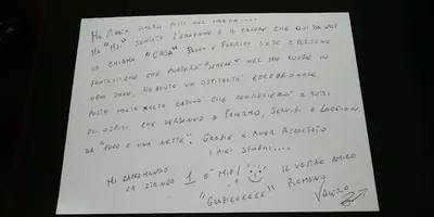 a piece of paper with handwriting on it at B&B Orchidea in Palermo