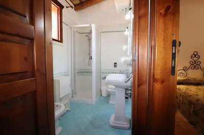 a bathroom with a sink and a toilet and a shower at EVEN HAVEN Baglio in San Vito lo Capo